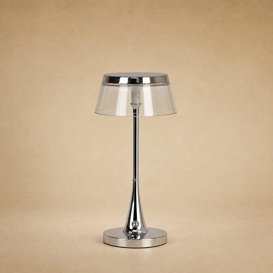 Lampe rechargeable Sévali, abat-jour transparent et couronne chromée, hauteur 27 cm | Delvanie