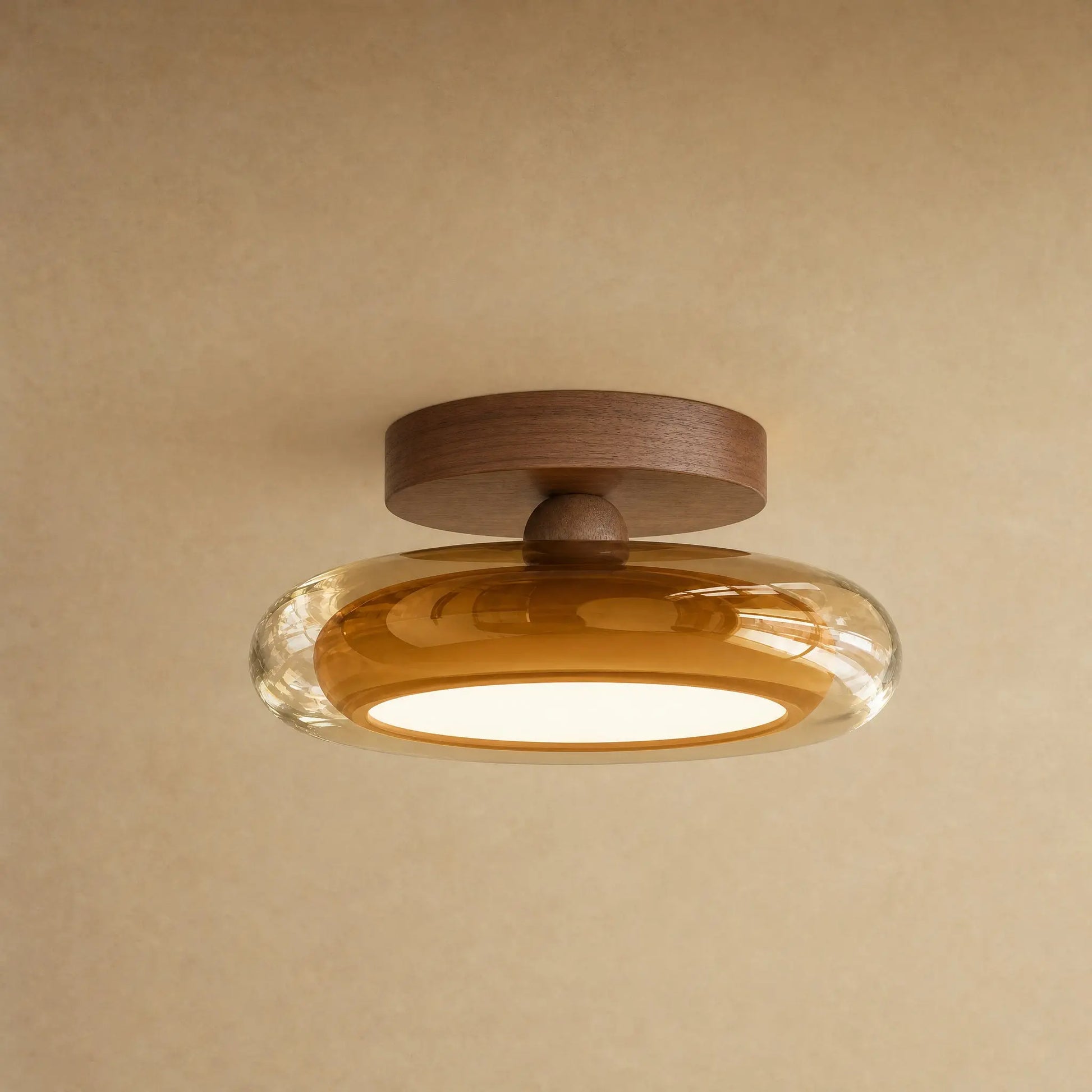 Plafonnier en verre ambré et platine effet noyer, galet Prismya | Delvanie