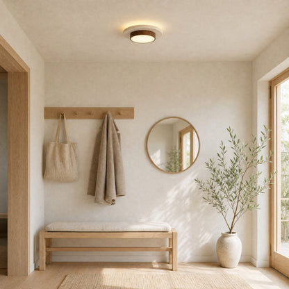 Plafonnier travertin dans une entrée scandinave lumineuse | Delvanie