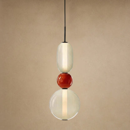 Suspension verre coloré Zuccara, trois perles à bille rouge et crème, hauteur 39 cm | Delvanie